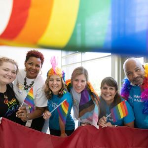 DeAnna Lowe, Cicely Hart, Kristie McKillip, Susan Wilde, Julie Orben and Harley McCorkle with pride flags