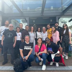 A team of people posed outside