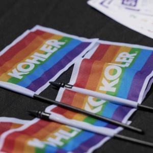 Close up of small rainbow flags with "Kohler".
