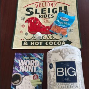 Items arranged on top of a gift bag.