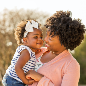 woman holding small child 