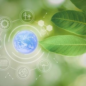 Leaf with symbols of wind power, recycling, hydropower, solar power and ecology.