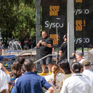 person speaking at outdoor event