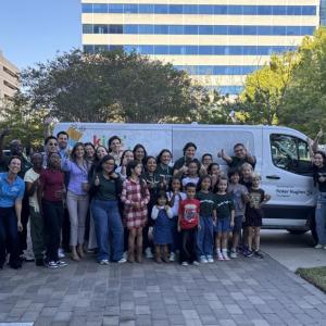 people standing in front of Baker Hughes van