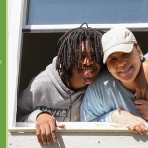 People in home window with quote "My family would get together on holidays, and I am excited to have that in my new home for my own son."