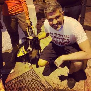 Karim is pictured here with a rescue dog named Flash.