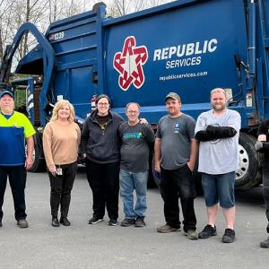 people in front of a republic services truck