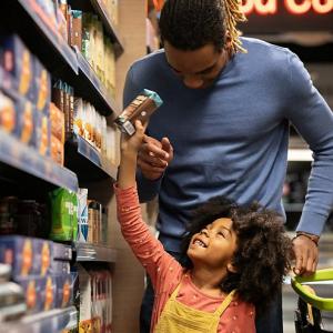 Father and child shopping in grocery store