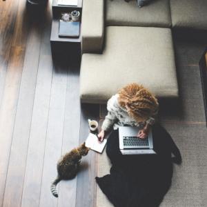 Person working from home with their cat