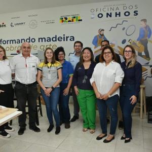 A group of people posed in a workshop
