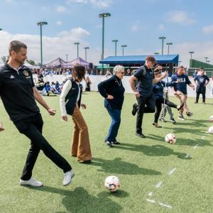 Community leaders and LA Galaxy representatives participate in a ceremonial kickoff during the Youth Adaptive Sports Program, celebrating the program’s mission to create inclusive sports experiences for athletes of all abilities.
