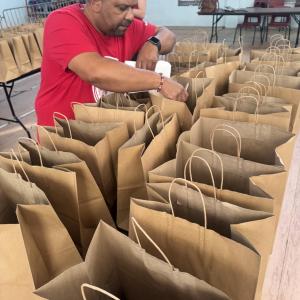Bacardi employee filling bags