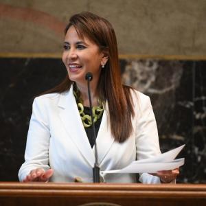 Patty Riddlebarger speaking at a podium