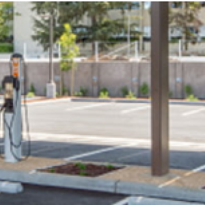 A parking lot with multiple EV charging stations.
