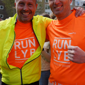 Two runners in matching shirts.