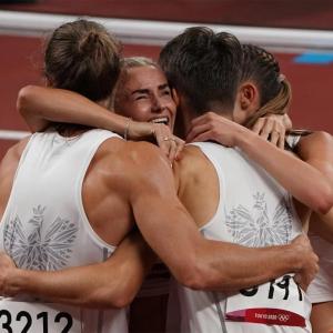 Runners hugging on the track