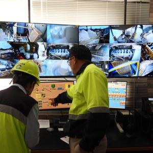 people looking at computers together