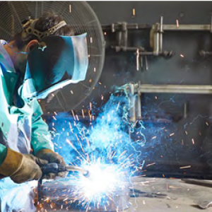 A person welding with protective gear on