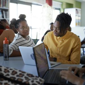 black students working on laptops