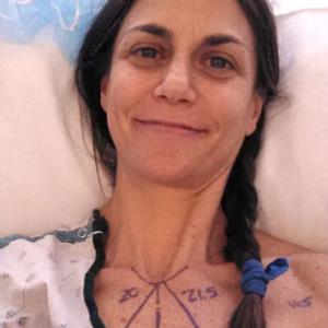 Samantha Harris in a hospital bed, markings on her chest