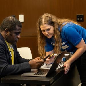 Two people looking at mobile phones 