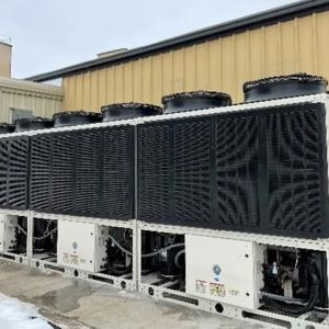 A large, industrial, cooling system outside a building.