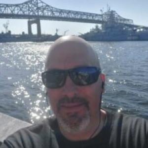 scott cabral with a bridge in the background