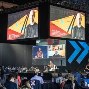Conference stage and attendees