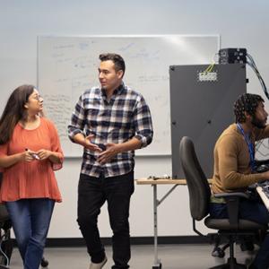 three people in a computer lab