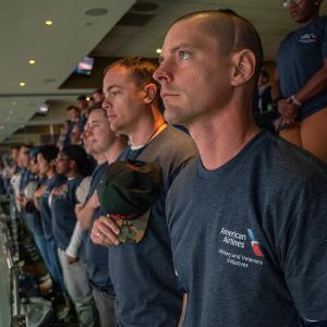 People wearing an American airlines t-shirt at a game