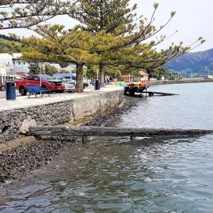Seawall with mountains in background