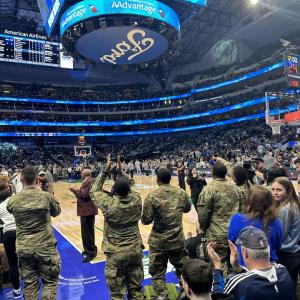 Soldiers cheering courtside