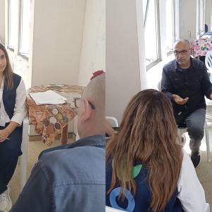 Mahmoud tells an Action Against Hunger staff member about his experience. 