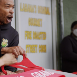 People cutting ribbon at grand opening