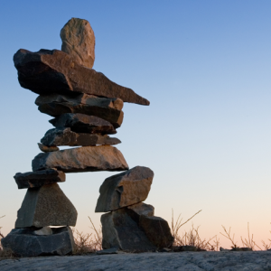 An inuksuk in Nova Scotia. These traditional travel markers serve as important cultural symbols for Inuit and other Indigenous Canadian peoples. Photo: Getty Images