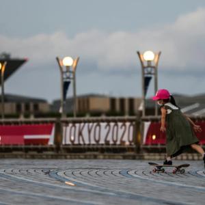 a child on a skateboard on a paved street