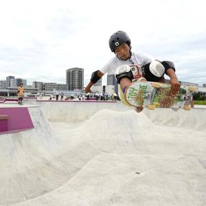 a child skate boarding in a skate park
