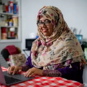 Rifat Kabir Sharna using a laptop