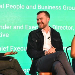 John Loveseth on stage with two women