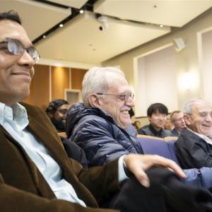 audience members smiling and laughing