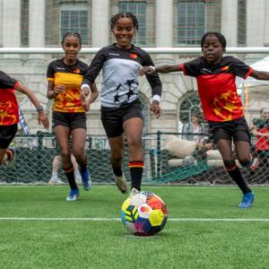 Children playing soccer.
