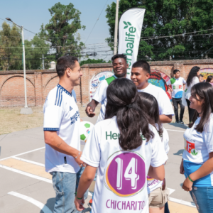 Javier Chicharito meeting with kids on a playground.