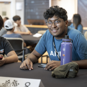 Students sitting at a table in a classroom