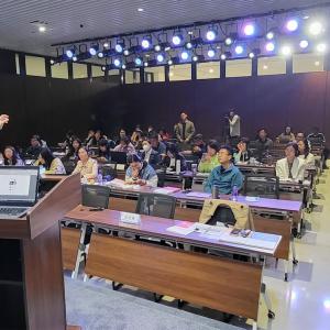 speaker speaking to a group