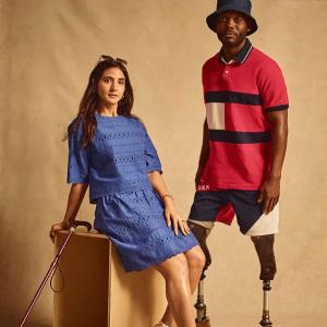 A female model with a cane and a male model with prosthetic legs.