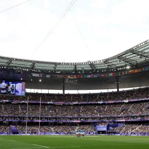 Wide view of a grassy-field and stadium