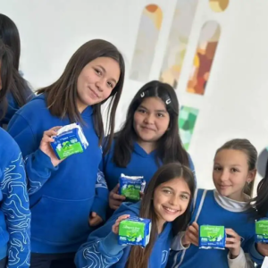 girls holding up boxes of stayfree products