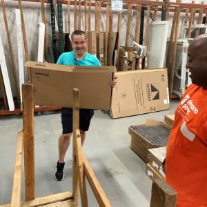 Volunteers moving boxes in the store.