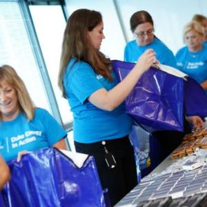 Duke Energy employee volunteers packing Storm kits 