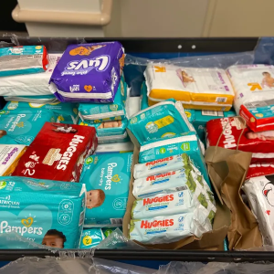 A bin of new, packaged diapers